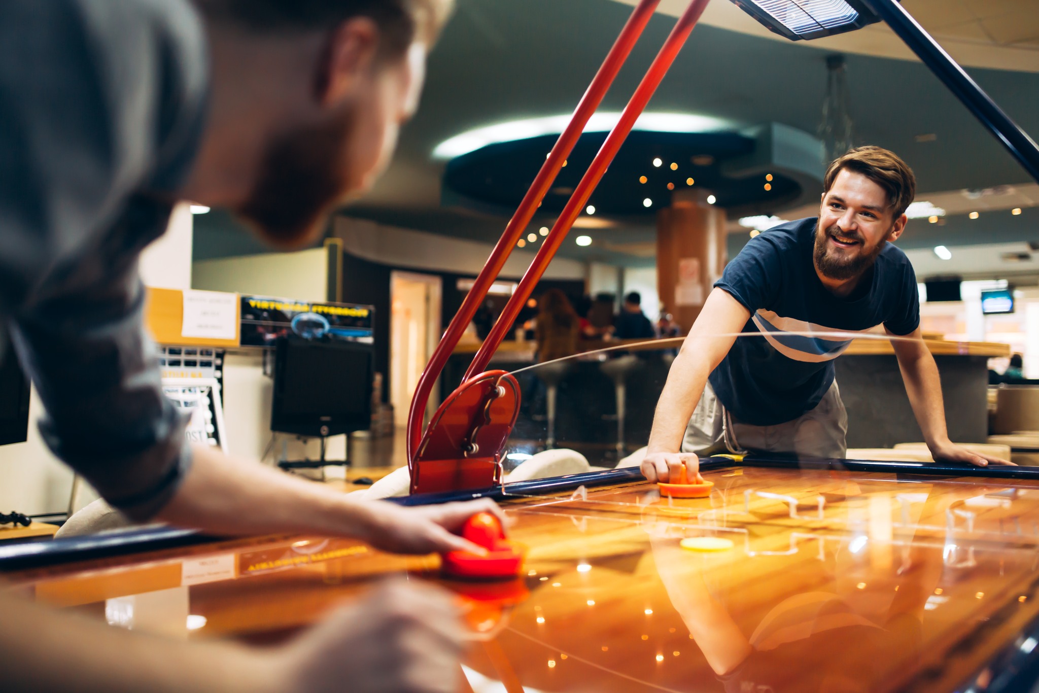 Air hockey game  is fun even for adults